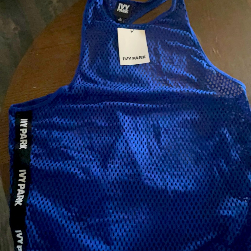 Ivy Park racerback tank top with IVY PATK strip on sides